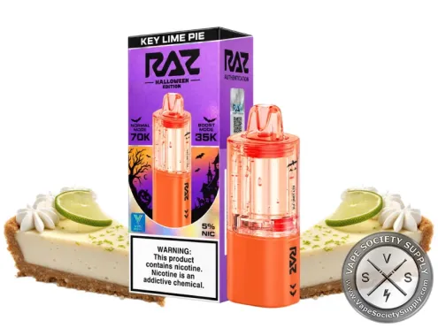 Orange RAZ VUE 70K Halloween Edition Key Lime Pie pod next to its purple box, between slices of key lime pie