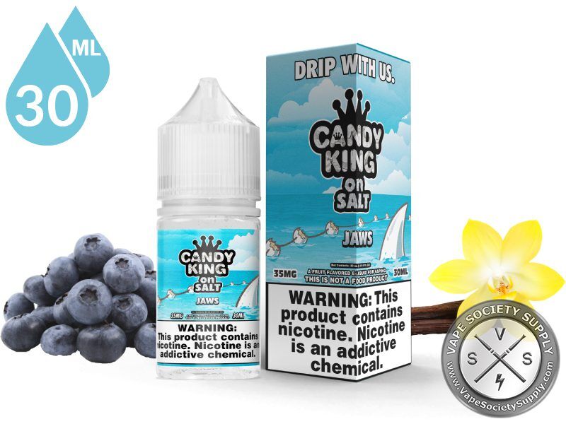 Jaws Candy King On Salt 30ml bottle and box with blueberries, a vanilla flower and vanilla beans