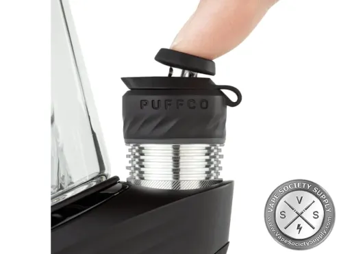A finger on the Joystick Cap of a Puffco Peak Pro 3DXL