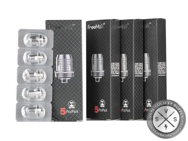 Five FreeMax X mesh coils in a blister strip beside black FreeMax coil boxes