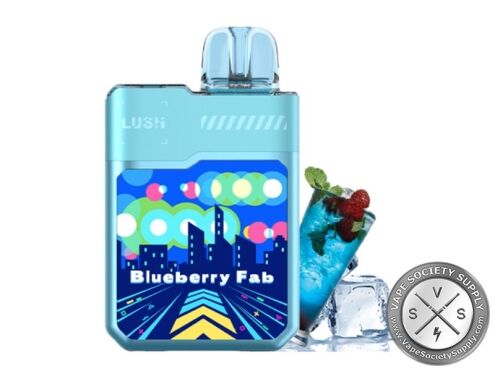Geek Bar LUSH 20K Blueberry Fab disposable vape in light blue, next to a glass of blue drink with berries, and ice cubes