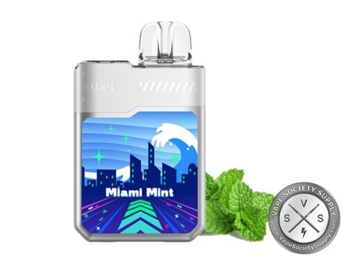 Geek Bar LUSH 20K Miami Mint disposable vape in white, next to mint leaves
