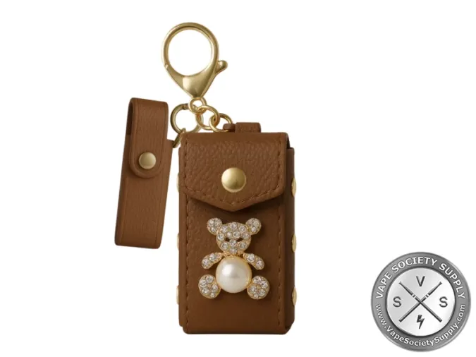 Brown Smyle Pursejamin clutch with a teddy bear and pearl charm and a gold keyring
