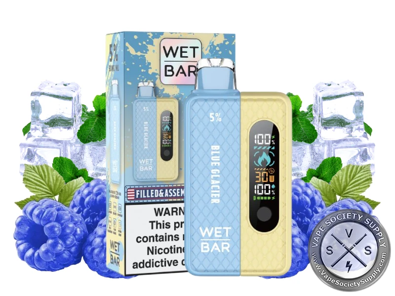 Wet Bar 35K Vape Kit Blue Glacier kit with its box, next to blue raspberries, ice cubes and mint leaves