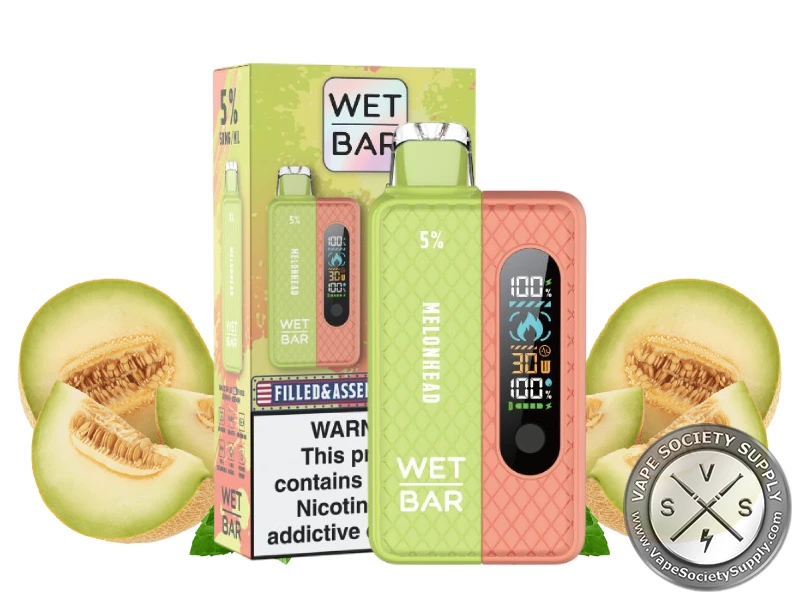 Wet Bar 35K Vape Kit Melonhead kit with its box, next to melon halves