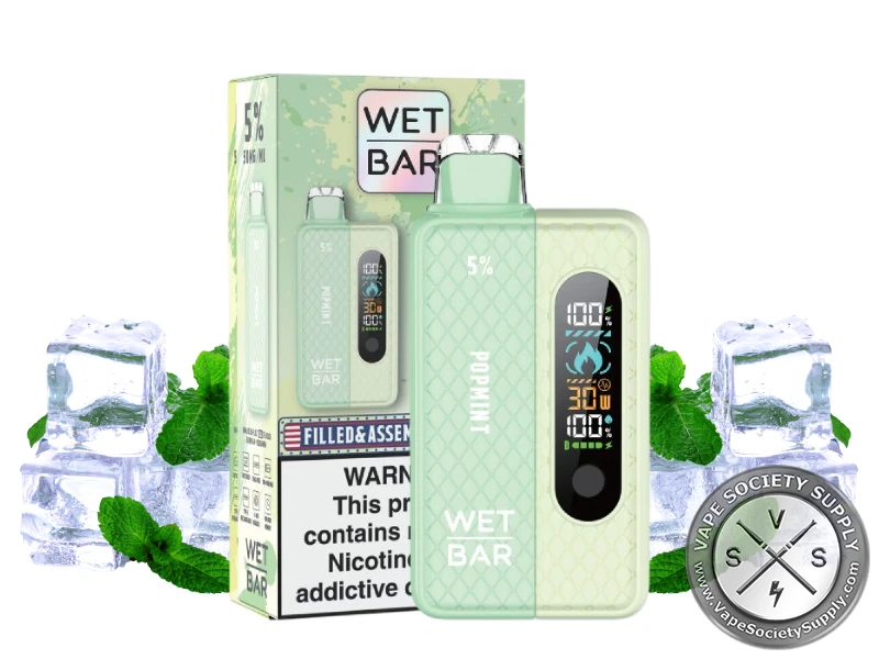 Wet Bar 35K Vape Kit Popmint kit with its box, next to ice cubes and mint leaves