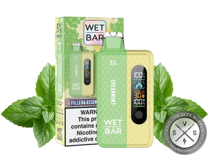 Wet Bar 35K Vape Kit Spearmint kit with its box, next to mint leaves