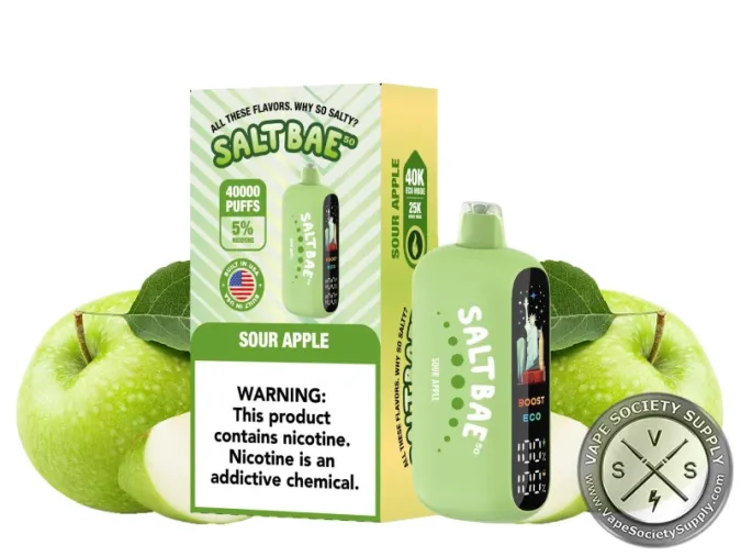 SaltBae50 Sour Apple disposable vape in green, with its box, next to green apples