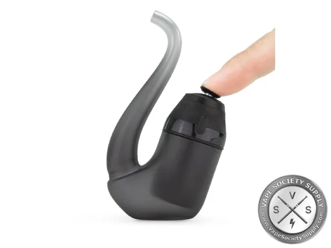 A finger on the Joystick Cap of a Puffco New Proxy in Onyx, fitted in its glass pipe